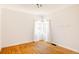 Bright, empty bedroom with hardwood floors and natural light at 650 Kearney St, Denver, CO 80220