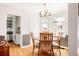 Bright dining room with a round table, four chairs, stylish lighting, and hardwood floors at 650 Kearney St, Denver, CO 80220