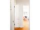 Hallway view with built-in storage leading to a bright living area at 650 Kearney St, Denver, CO 80220