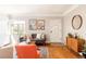 Inviting living room with hardwood floors, a modern sofa, and art-adorned walls at 650 Kearney St, Denver, CO 80220