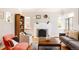 Bright living room with hardwood floors, a cozy fireplace, and large windows for natural light at 650 Kearney St, Denver, CO 80220