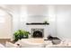 Bright living room featuring a fireplace, ample seating, and natural light at 650 Kearney St, Denver, CO 80220