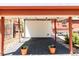 Inviting covered patio with string lights, brick pavers and neutral tones, perfect for outdoor gatherings and relaxation at 650 Kearney St, Denver, CO 80220