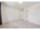 Spacious carpeted bedroom with neutral walls and a doorway leading to another room at 6559 S Locust Way, Centennial, CO 80111