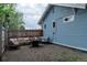 Back yard featuring string lights, a fire pit, and outdoor furniture, creating an inviting space for relaxation at 134 S Quitman St, Denver, CO 80219