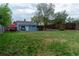 Expansive backyard with a well-maintained lawn and privacy fencing, great for recreation at 134 S Quitman St, Denver, CO 80219