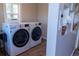 Convenient laundry area featuring modern LG washer and dryer at 134 S Quitman St, Denver, CO 80219