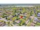 An aerial shot of a neighborhood highlighting the property and surrounding community near a lake at 3818 W 25Th Ave, Denver, CO 80211