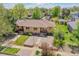 An aerial view of a home surrounded by lush landscaping and mature trees at 3818 W 25Th Ave, Denver, CO 80211