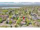 Aerial view of a home and its location within a charming neighborhood with a lake in the distance at 3818 W 25Th Ave, Denver, CO 80211