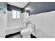 This bathroom features a toilet, tub, shower, and window offering natural light at 3818 W 25Th Ave, Denver, CO 80211