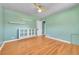 This is a bedroom featuring built-in shelving, hardwood floors, and natural light at 3818 W 25Th Ave, Denver, CO 80211