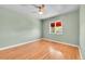 This bedroom features a ceiling fan, hardwood floors, and a window offering lots of natural light at 3818 W 25Th Ave, Denver, CO 80211