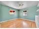 This is a bedroom with hardwood floors and natural light from the windows at 3818 W 25Th Ave, Denver, CO 80211