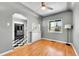 Cozy dining area with hardwood floors and a charming vintage ceiling fan at 3818 W 25Th Ave, Denver, CO 80211