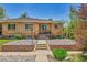 Charming brick home with cozy front porch and well-manicured stone landscaping at 3818 W 25Th Ave, Denver, CO 80211