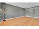 Open living room featuring hardwood floors and modern light fixture at 3818 W 25Th Ave, Denver, CO 80211