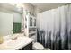 Bathroom with a shower and modern white vanity, offering a clean and functional space at 1232 Bluebird St, Brighton, CO 80601