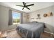 Cozy bedroom featuring neutral walls, plush carpet, and a ceiling fan at 1232 Bluebird St, Brighton, CO 80601