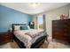 Comfortable bedroom with a cozy bed, ample natural light from the window, and neutral walls at 1232 Bluebird St, Brighton, CO 80601