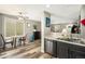 Open floor plan with dining area adjacent to the kitchen and living room, perfect for entertaining at 1232 Bluebird St, Brighton, CO 80601