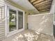 Outdoor patio with sliding glass door access and wooden beams above at 13645 E Yale Ave # C, Aurora, CO 80014