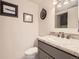 This powder room includes a gray vanity and is nicely decorated at 13645 E Yale Ave # C, Aurora, CO 80014
