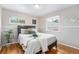Serene bedroom with hardwood floors, natural light, and decorative accents at 6513 Gray St, Arvada, CO 80003