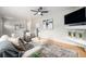Comfortable living room features a ceiling fan, modern decor, and plush seating at 6513 Gray St, Arvada, CO 80003