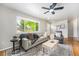 Inviting living room with large window, hardwood floors, and stylish furnishings at 6513 Gray St, Arvada, CO 80003