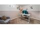 Bright home office featuring a modern desk, comfortable chair, and artwork at 6513 Gray St, Arvada, CO 80003