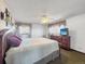 Spacious bedroom with large bed, ceiling fan, and a dresser with television at 1941 E 119Th Pl, Northglenn, CO 80233