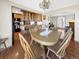 Dining area adjacent to kitchen with a wooden table, chairs, and view to the living area at 1941 E 119Th Pl, Northglenn, CO 80233