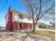 Charming two-story home with a brick facade, front porch, and a spacious two-car garage at 1941 E 119Th Pl, Northglenn, CO 80233