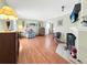 Cozy living room featuring hardwood floors, a fireplace, and comfortable furniture at 1941 E 119Th Pl, Northglenn, CO 80233