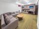 Cozy living room with fireplace, television, and large sofa for relaxing evenings at 1941 E 119Th Pl, Northglenn, CO 80233