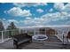 Stunning deck with panoramic views featuring a built-in fire pit, comfortable seating, plus steel railing at 1150 Madge Gulch Rd, Sedalia, CO 80135