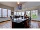 Kitchen island with dining table and chairs in a room with large windows and scenic views at 1150 Madge Gulch Rd, Sedalia, CO 80135
