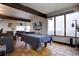 Living room with a pool table, tile floor, large windows, and scenic outside views at 1150 Madge Gulch Rd, Sedalia, CO 80135