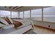 Bright main bedroom with beautiful hardwood floors, expansive windows and natural light, plus views of the horizon at 1150 Madge Gulch Rd, Sedalia, CO 80135