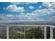 Expansive view from the deck with beautiful blue skies, scattered clouds, and rolling green hills in the distance at 1150 Madge Gulch Rd, Sedalia, CO 80135