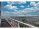 Breathtaking view from deck with steel railing, featuring expansive views and rolling green hills in the distance at 1150 Madge Gulch Rd, Sedalia, CO 80135