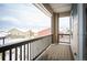 Scenic view from the balcony overlooking neighboring houses and a snowy landscape at 10786 Bear Cub Dr, Broomfield, CO 80021