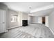Spacious finished basement featuring a fireplace, built-ins, and ample natural light at 10786 Bear Cub Dr, Broomfield, CO 80021