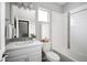 Cozy bathroom with vanity and shower-tub combo featuring sleek fixtures and tile at 10786 Bear Cub Dr, Broomfield, CO 80021