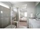 Beautiful bathroom featuring a glass-doored shower and vanity with a sink at 10786 Bear Cub Dr, Broomfield, CO 80021