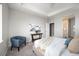 Bright bedroom with tray ceiling, comfortable seating, and modern decor at 10786 Bear Cub Dr, Broomfield, CO 80021