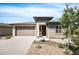 Charming single-Gathering home boasts a two-car garage, stone accents, and a well-maintained landscaped front yard at 10786 Bear Cub Dr, Broomfield, CO 80021