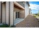 Patio view with basement access and rock features, accented with stone design at 10786 Bear Cub Dr, Broomfield, CO 80021