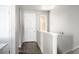 Bright hallway featuring hardwood floors and a clean, minimalist design at 10786 Bear Cub Dr, Broomfield, CO 80021